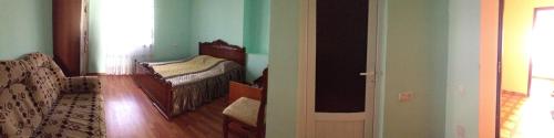 a room with a bedroom with a bed and a door at Arevik BB in Chʼiva
