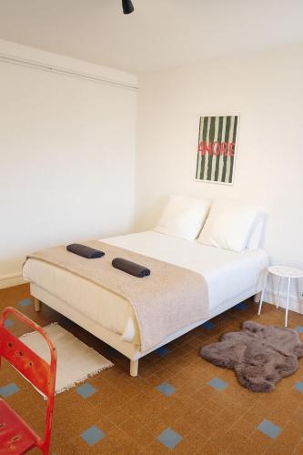 Ένα ή περισσότερα κρεβάτια σε δωμάτιο στο Grand appartement 3 chambres Wifi & Parking