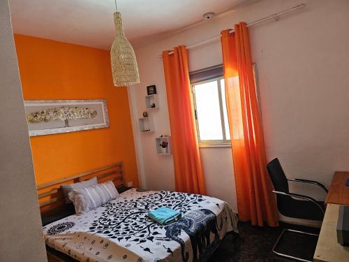 Giường trong phòng chung tại Casa Rita La Caleta de Arico