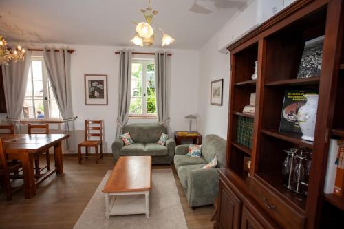 a living room with a couch and a table at Gite Passart à Brancion in La Chapelle-sous-Brancion