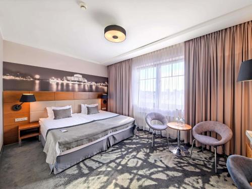 Postel nebo postele na pokoji v ubytování Mercure Bydgoszcz Sepia