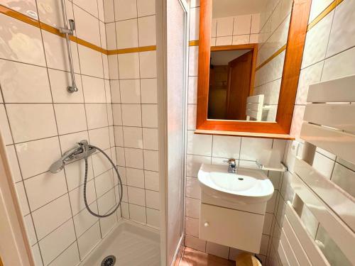 a bathroom with a sink and a shower and a mirror at Chalet 5 pièces, 8 pers, au coeur de St Martin de Belleville, proche pistes et commodités - FR-1-452-65 in Saint-Martin-de-Belleville