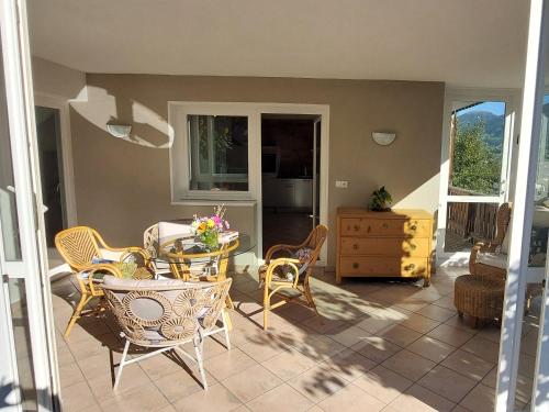 a patio with a table and chairs and a table at Haus Statz 48 Parterre in Statz
