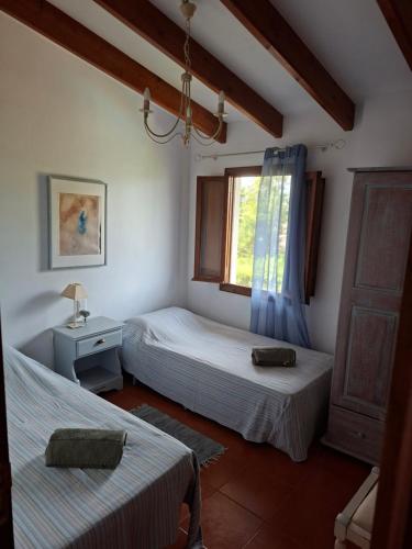 Postel nebo postele na pokoji v ubytování CortijoRamon