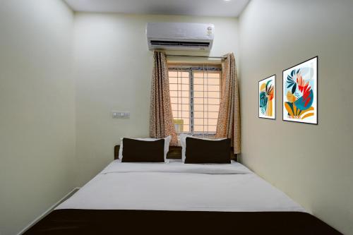 Ένα ή περισσότερα κρεβάτια σε δωμάτιο στο Hotel O The Dream Inn