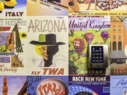 a collage of different types of posters on a wall at hotelF1 Nantes Est La Beaujoire in Nantes