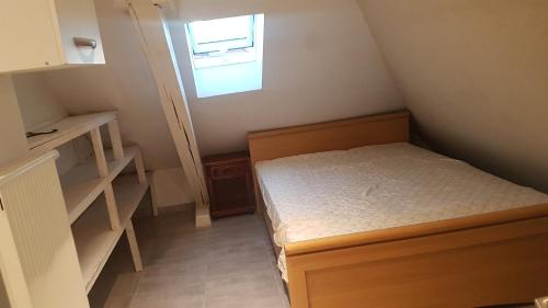 Ένα ή περισσότερα κρεβάτια σε δωμάτιο στο Chez maman