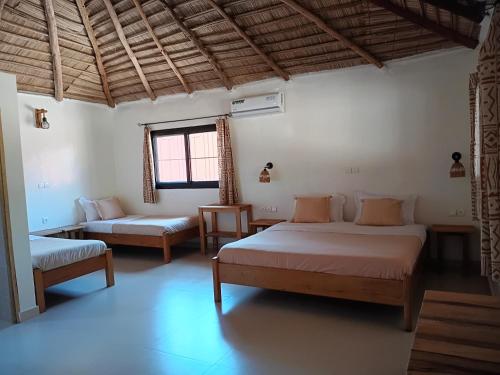 Llit o llits en una habitació de JAMNAATI Campement