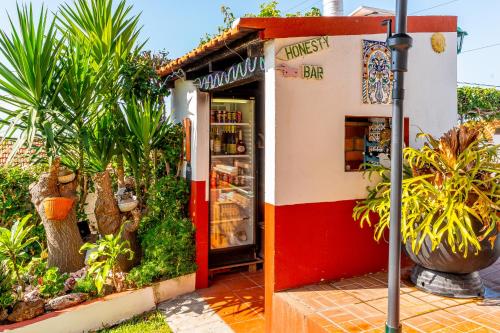 a small store with a red and white at Apartments Vista Oceano in Funchal