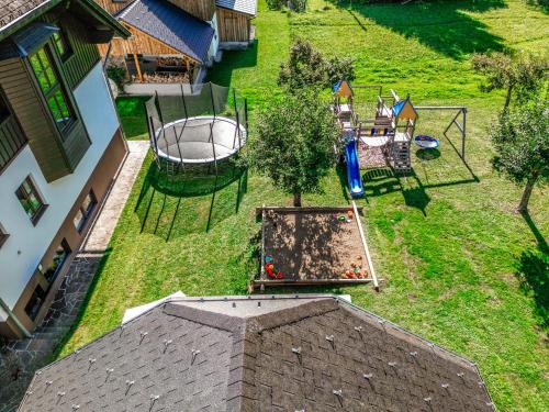 an aerial view of a backyard with a playground at Ferienhaus Angerer in Obersdorf