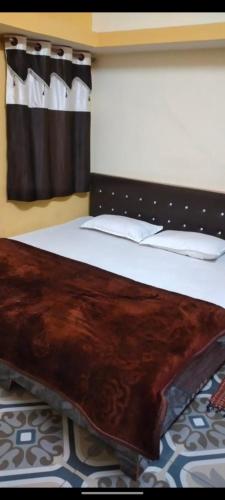 Ένα ή περισσότερα κρεβάτια σε δωμάτιο στο Shikhar guest house