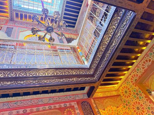 a ceiling of a building with a chandelier at Riad Las mil y una noches 2 Tetuan in Tetouan