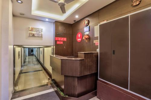 an elevator in a building with an escalator at Hotel O Raj Residency in Cuddalore