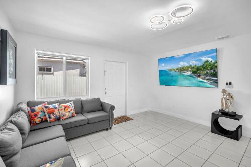 a living room with a couch and a view of the ocean at Costerra Miami 2BR in Miami
