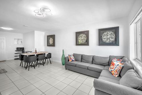 a living room with a couch and a table at Costerra Miami 2BR in Miami