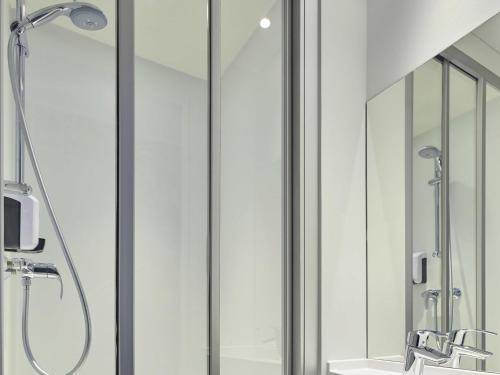a bathroom with a shower and a sink at hotelF1 Mulhouse Centre Ouest in Mulhouse