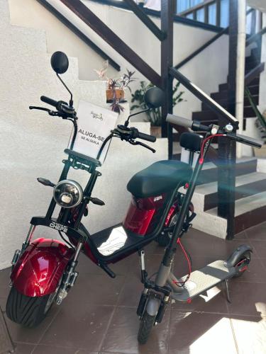 a motor scooter parked next to a building at Nova Aldeia Buzios in Búzios