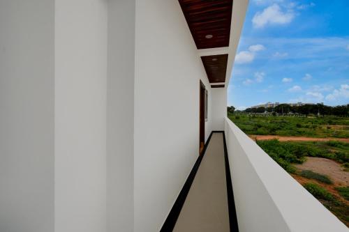 a view from the balcony of a house at Hotel O Bright Inn near TCS in Hyderabad