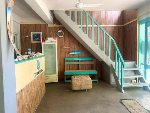 a kids room with a staircase and a table at Ocean Pearl in Gulhi