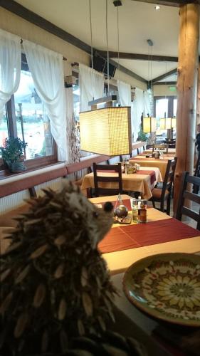 a restaurant with tables and chairs and a dining room at Family Hotel Eterno in Tsigov Chark