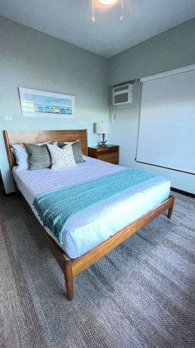 a bedroom with a large bed in a room at Oceania Villas in Culebra