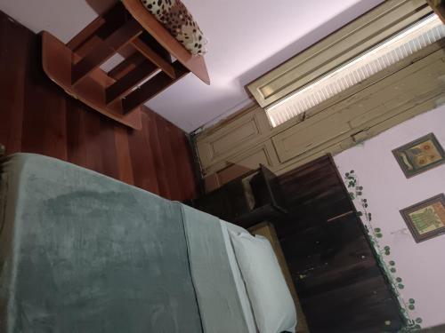 a room with wooden walls and a ceiling at Habitación individual Privada Casa compartida in Montevideo