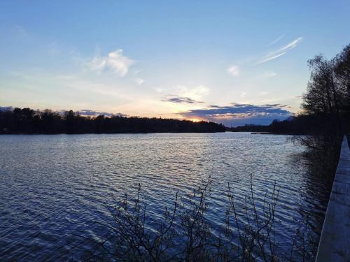 a view of a large body of water at sunset at 4 person holiday home in HUDDINGE-By Traum in Huddinge