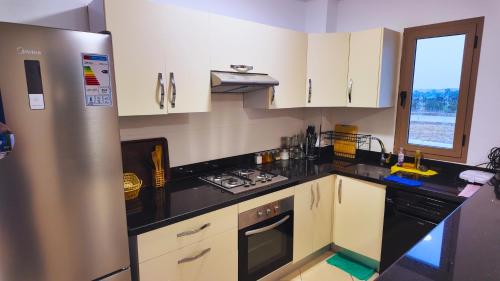 Kuchyň nebo kuchyňský kout v ubytování Assilah Beralmar New Flat with Pool+Beach