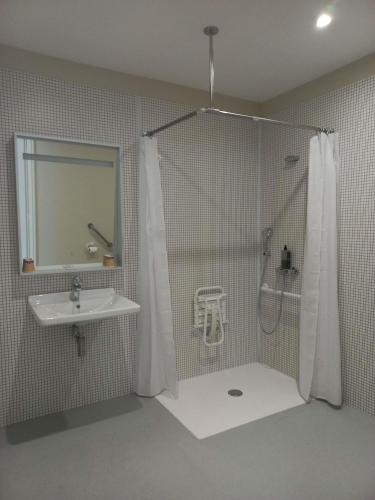 a bathroom with a shower and a sink at ibis budget Antony Massy rénové 2024 in Antony