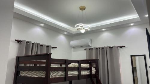 Ένα ή περισσότερα κρεβάτια σε δωμάτιο στο home in Macau