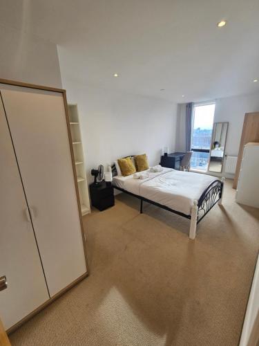 a bedroom with a bed and a large mirror at 4 Beds Luxury Flat with the Best London View in London