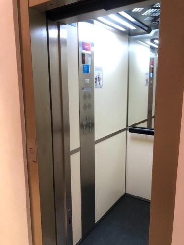 a row of elevators in an office building at HN Salteras in Salteras