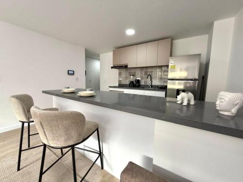 Η κουζίνα ή μικρή κουζίνα στο Unicentro Apartamentos, WiFi y Parking Gratis