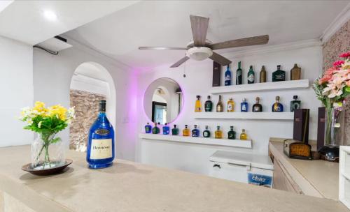 a kitchen with a bottle of wine on a counter at Casa Mary Hotel in Cartagena de Indias