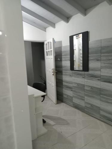 a bathroom with a sink and a mirror on the wall at Casa Teresa in El Talar de Pacheco