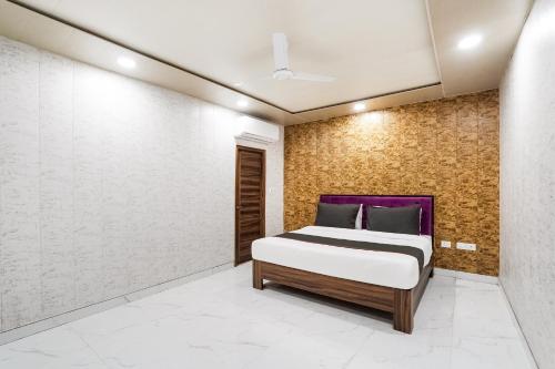 Ένα ή περισσότερα κρεβάτια σε δωμάτιο στο Hotel O Howdy