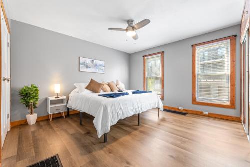 a bedroom with a bed and a ceiling fan at Main Floor Tremont Home with KING Bed, Mins From DT, Pet Friendly in Cleveland