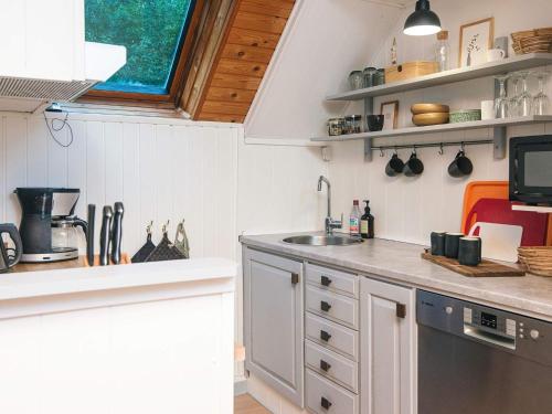 a kitchen with a sink and a counter top at 6 person holiday home in Herning in Herning