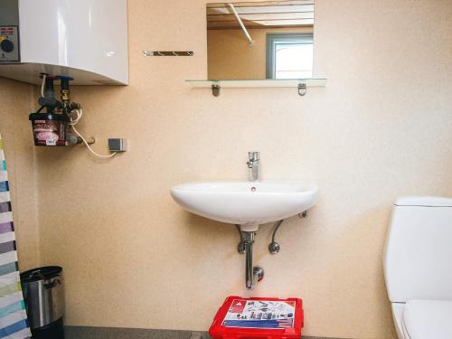 a bathroom with a sink and a toilet at 6 person holiday home in Hovborg in Hovborg