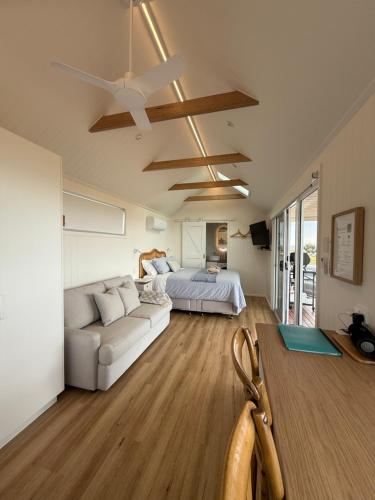 a living room with a couch and a bed at The Bay overlooking Boston Island in North Shields