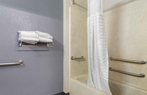 a bathroom with a shower and white towels at Extended Stay America Suites - Pittsburgh - Monroeville in Monroeville