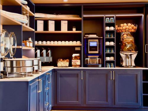 Kuchyň nebo kuchyňský kout v ubytování Ibis Budget Nantes Rezé Aéroport