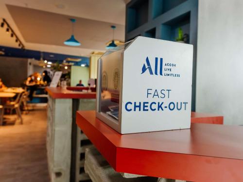 a fast check out box sitting on a table at ibis budget Vitoria in Vitória