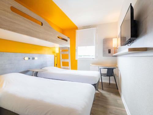 Un ou plusieurs lits dans un hébergement de l'établissement ibis budget Carcassonne Aéroport - A61