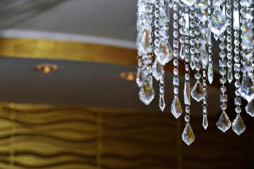 a close up of a chandelier with crystals at Ariston Suite in Piazza Armerina