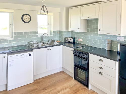 Η κουζίνα ή μικρή κουζίνα στο Honeysuckle Apartment - Uk49308