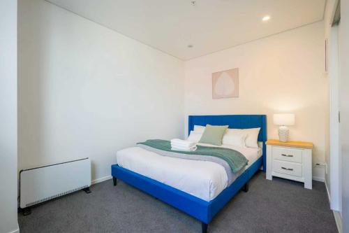 Ένα ή περισσότερα κρεβάτια σε δωμάτιο στο Brand New CBD Apartment with Easy Campus Access