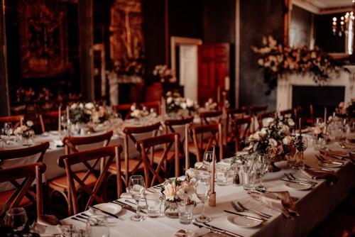 a table set up for a banquet in a room at Quamby Estate in Hagley