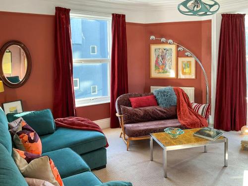 a living room with a couch and a table at The Artists Retreat in Whitby