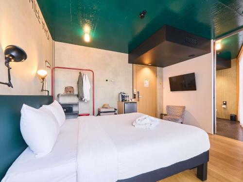 Postel nebo postele na pokoji v ubytování ibis Styles Bern City